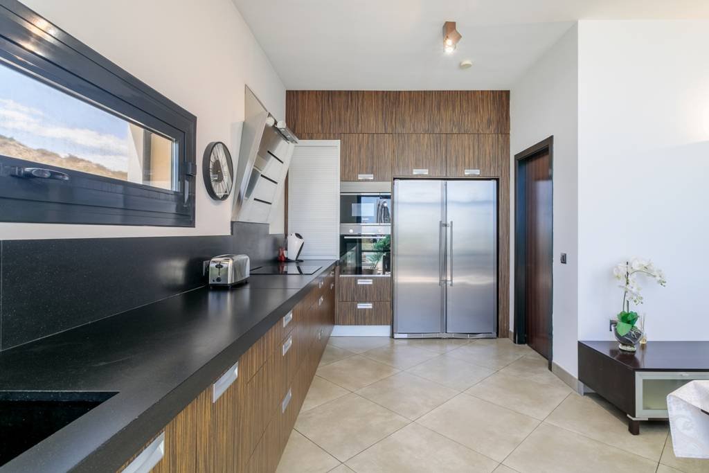 Modern villa with heated pool and spectacular panoramic views of the coast and sea, with rental licence