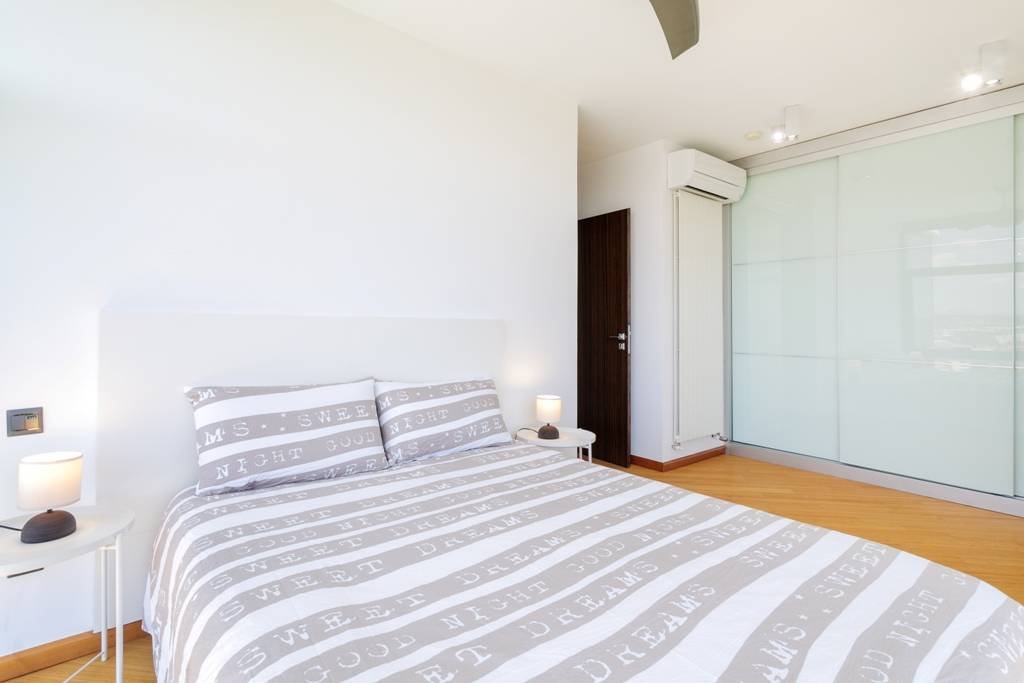 Modern villa with heated pool and spectacular panoramic views of the coast and sea, with rental licence