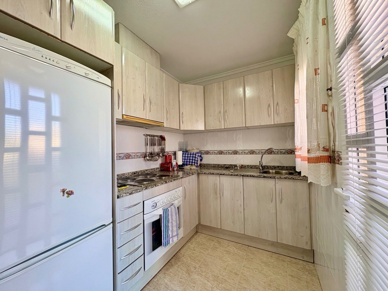 Two-bedroom terraced house with one bathroom, a guest toilet and a communal swimming pool in the La Fiesta II residential complex