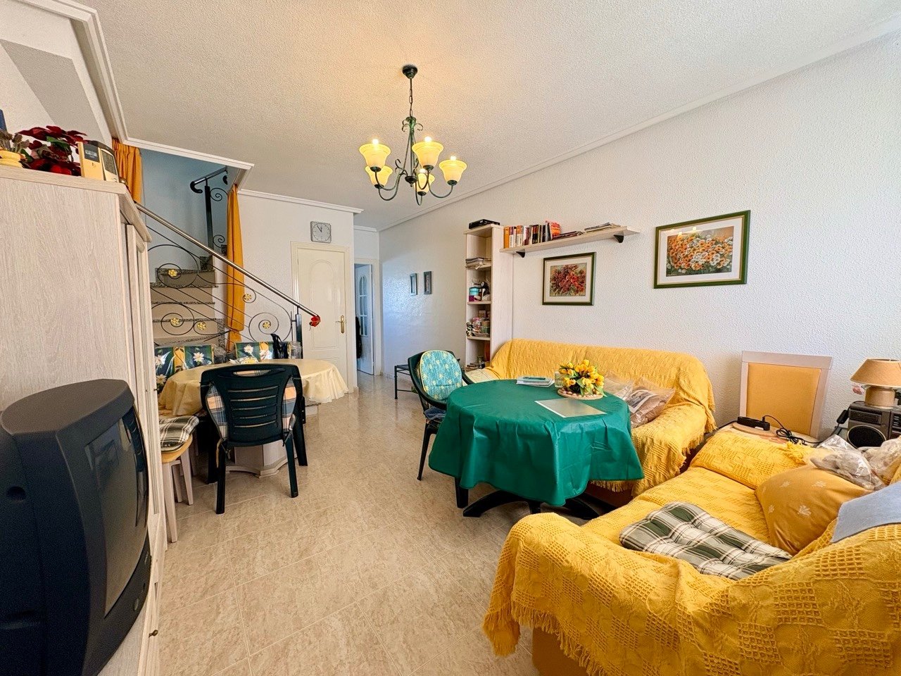 Two-bedroom terraced house with one bathroom, a guest toilet and a communal swimming pool in the La Fiesta II residential complex