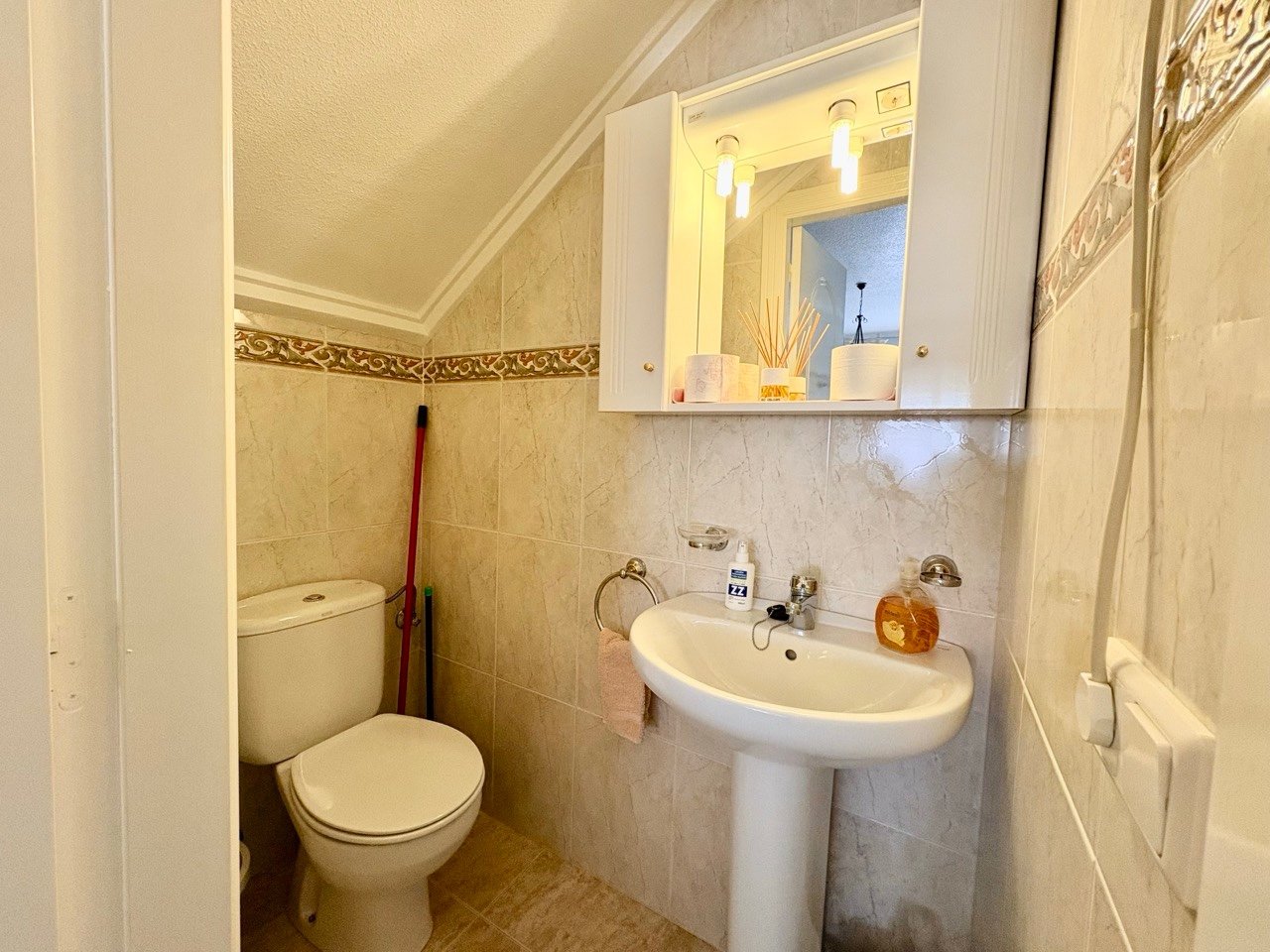 Two-bedroom terraced house with one bathroom, a guest toilet and a communal swimming pool in the La Fiesta II residential complex