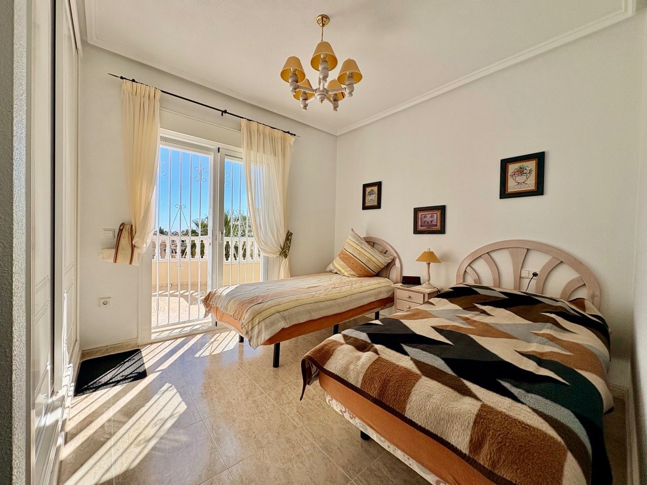 Two-bedroom terraced house with one bathroom, a guest toilet and a communal swimming pool in the La Fiesta II residential complex