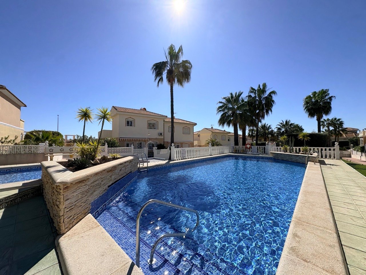 Two-bedroom terraced house with one bathroom, a guest toilet and a communal swimming pool in the La Fiesta II residential complex