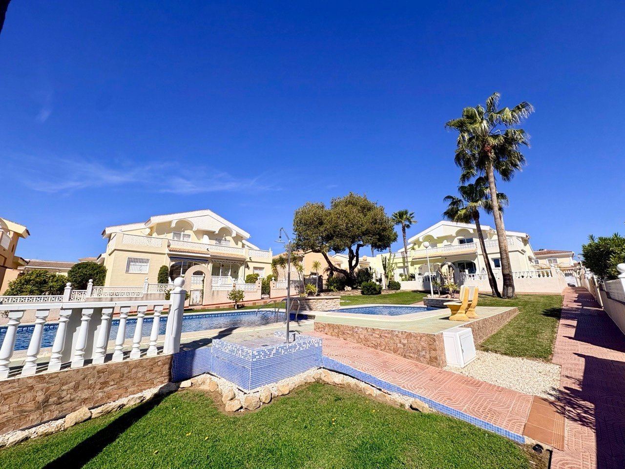 Two-bedroom terraced house with one bathroom, a guest toilet and a communal swimming pool in the La Fiesta II residential complex