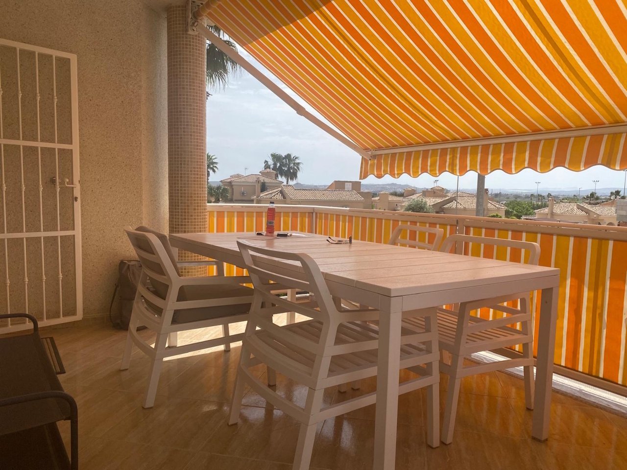 Detached villa with two residential units, a carport and a communal pool in a prime location