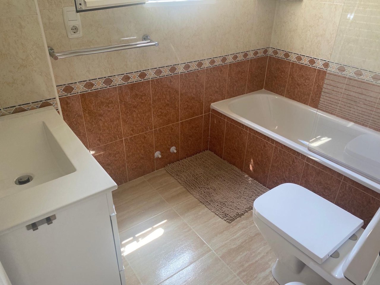 Detached villa with two residential units, a carport and a communal pool in a prime location