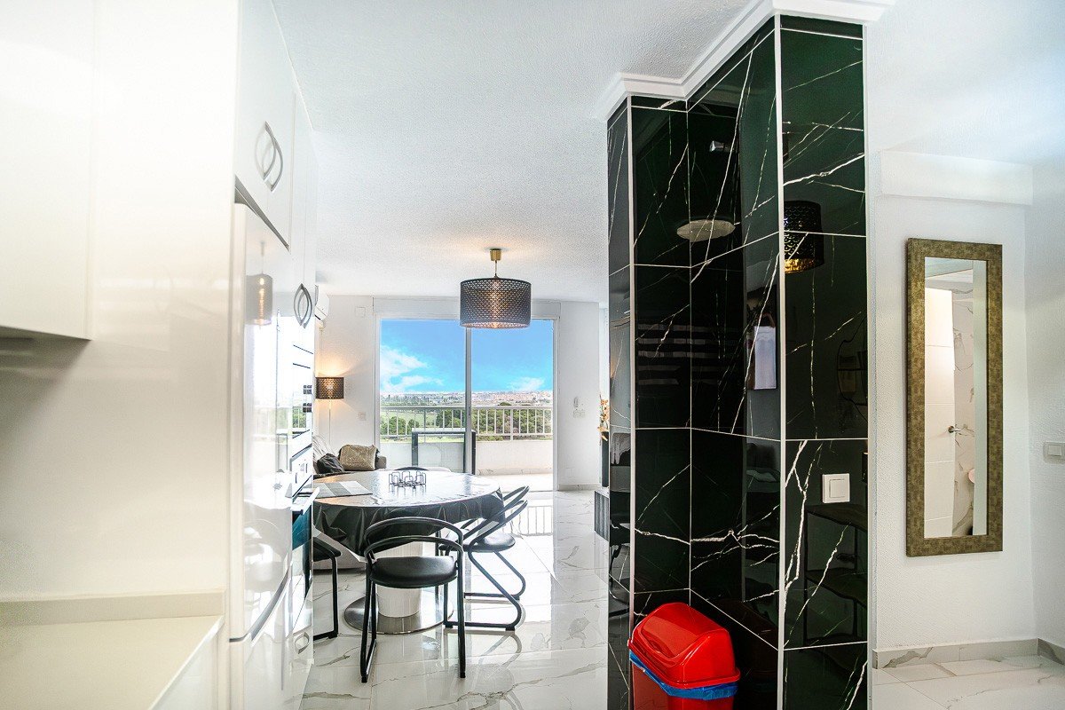 Beautifully renovated apartment with 2 bedrooms, 2 bathrooms, communal pool and sea views in Punta Prima just 300 meters from the sea
