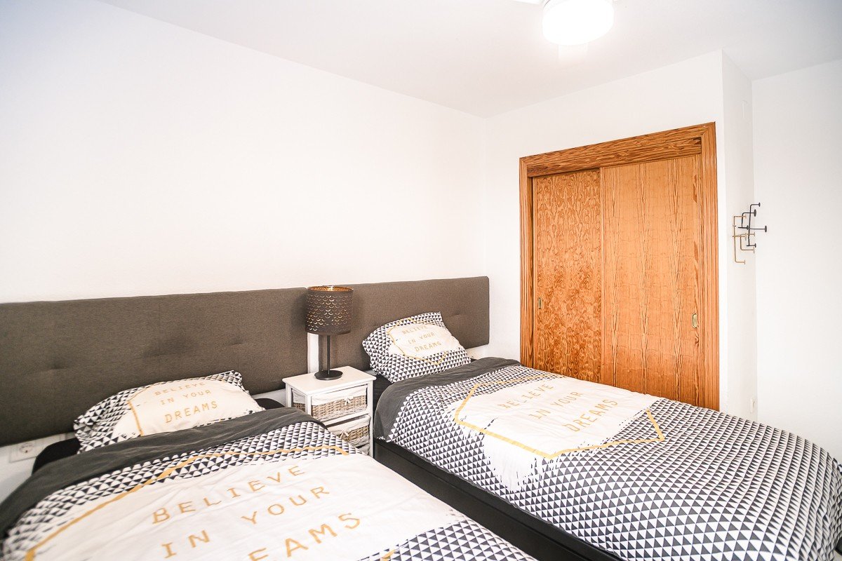Beautifully renovated apartment with 2 bedrooms, 2 bathrooms, communal pool and sea views in Punta Prima just 300 meters from the sea