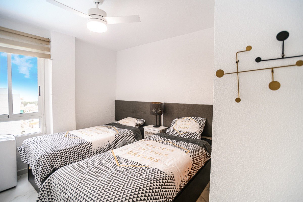 Beautifully renovated apartment with 2 bedrooms, 2 bathrooms, communal pool and sea views in Punta Prima just 300 meters from the sea