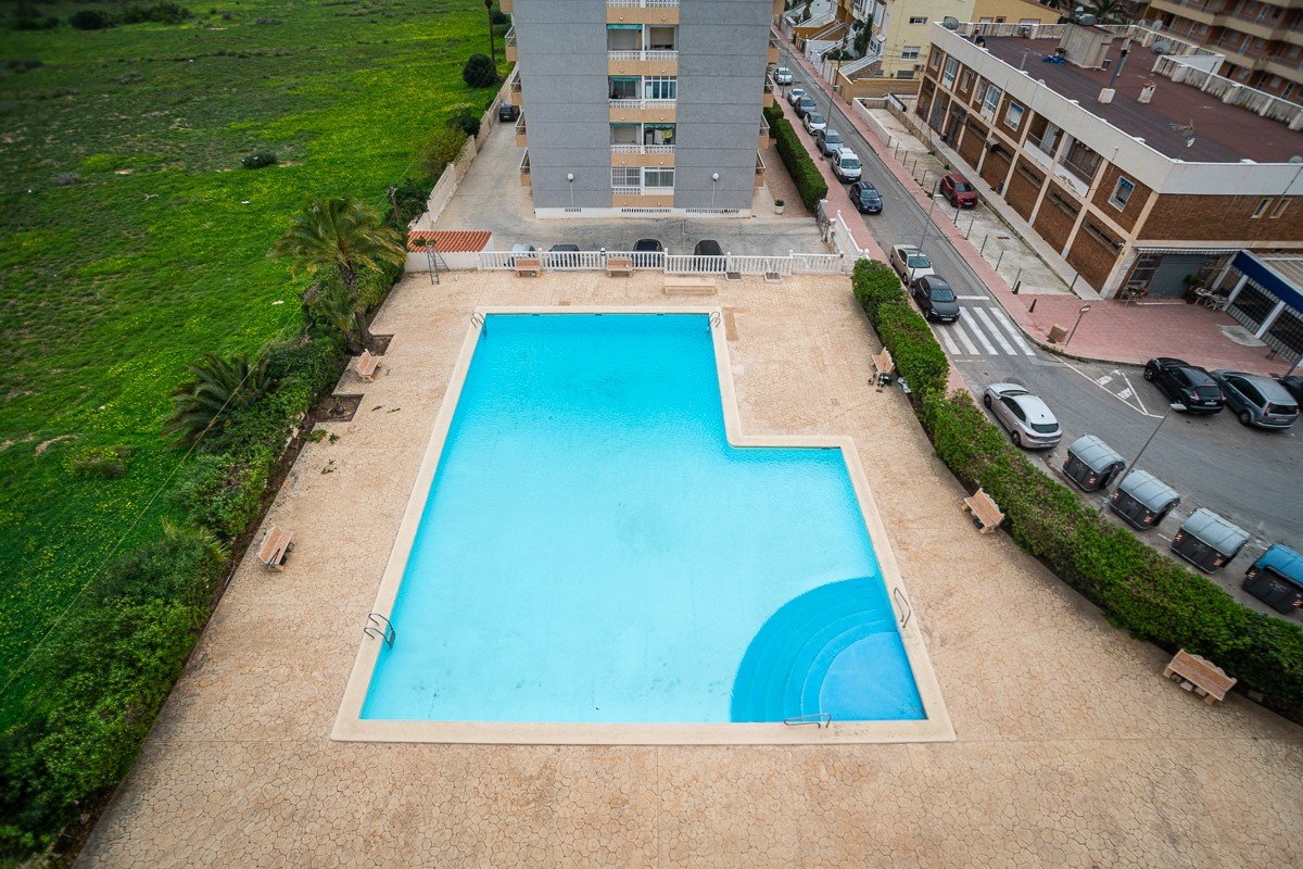 Beautifully renovated apartment with 2 bedrooms, 2 bathrooms, communal pool and sea views in Punta Prima just 300 meters from the sea